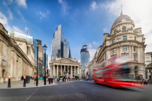 Bus passing by Bank of England building