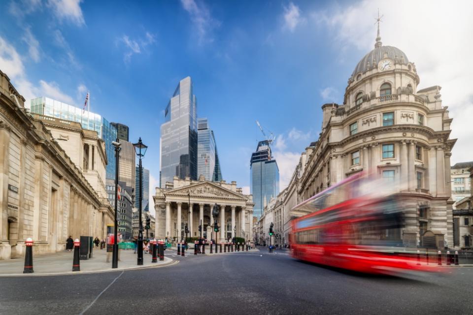 Bus passing by Bank of England building